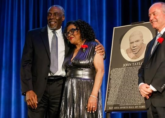 Bay Area Sports Hall of Fame inductee John Taylor poses for a photograph next to his plaque with his wife Elaine during the ceremony at the Hyatt Regency in San Francisco, Calif., on Monday, May 6, 2024. (Nhat V. Meyer/Bay Area News Group)