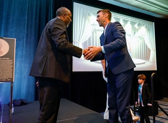 Bay Area Sports Hall of Fame inductees John Taylor, left, shakes hands with Chris Wondolowski at the Hyatt Regency in San Francisco, Calif., on Monday, May 6, 2024. (Nhat V. Meyer/Bay Area News Group)