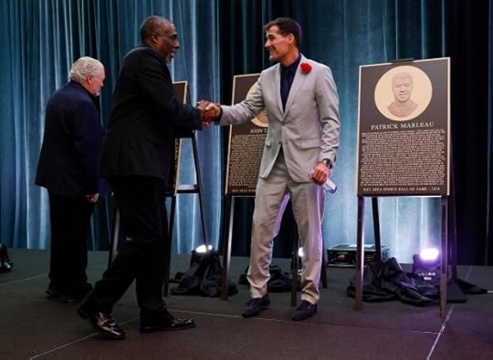 Bay Area Sports Hall of Fame inductees John Taylor, left, shakes hands with Patrick Marleau at the Hyatt Regency in San Francisco, Calif., on Monday, May 6, 2024. (Nhat V. Meyer/Bay Area News Group)