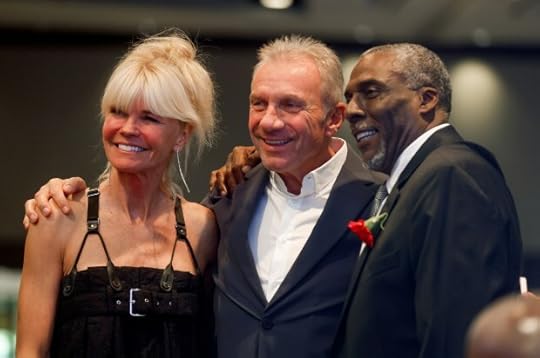 From left to right, Jennifer Montana, her husband Joe Montana, and John Taylor pose for a photograph at the Bay Area Sports Hall of Fame ceremony at the Hyatt Regency in San Francisco, Calif., on Monday, May 6, 2024. Taylor had just been inducted into the Bay Area Sports Hall of Fame. (Nhat V. Meyer/Bay Area News Group)