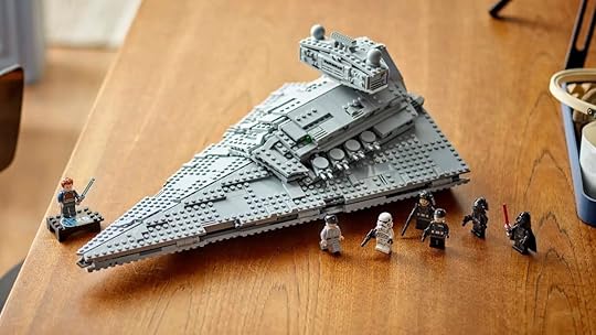 LEGO Imperial Star Destroyer on a table built with minifigs in front