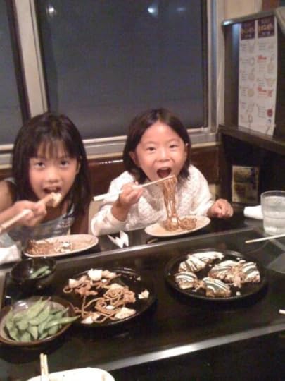 my daughters eating okonomiyaki and yakisoba