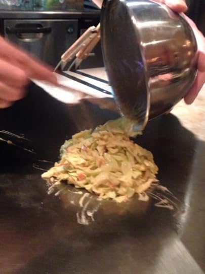 Pouring out the batter onto the hot, oiled griddle