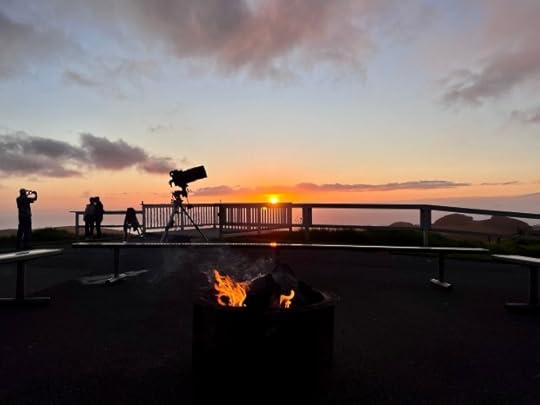 Two people pose for a photo as a third snaps the picture against the setting sun on the Big Island of Hawaii. (photo by Darleene Powells)