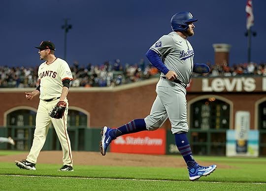 Los Angeles Dodgers’ Max Muncy #13 scores on a ground-rule...