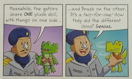 General Inspector Moe holding up a two-sided Brash/Mango plush