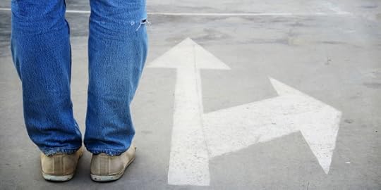 Feet standing by two arrows on pavement, one pointing forward and one off to the side—to illustrate the concept of a sidetrip