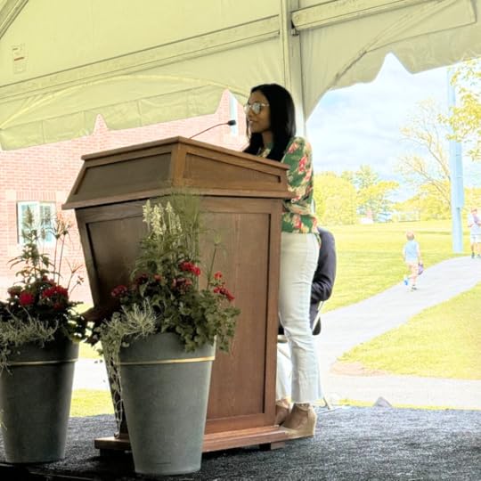 Amy Julia’s friend Niro speaks at a podium