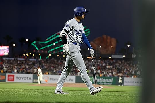 Los Angeles Dodgers’ Shohei Ohtani (17) heads back to the...