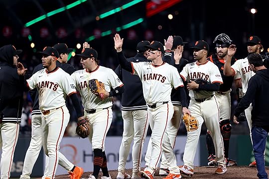 The San Francisco Giants take the mound as they celebrate...