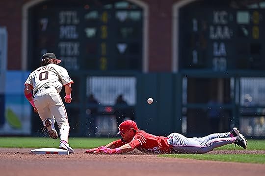 Cincinnati Reds’ TJ Friedl (29) steals second base as San...