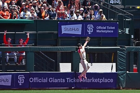 San Francisco Giants' Jung Hoo Lee (51) injuries himself while attempting to catch a fly ball hit by Cincinnati Reds' Jeimer Candelario (3) in the first inning of their MLB game at Oracle Park in San Francisco, Calif., on Sunday, May 12, 2024. Jung Hoo Lee would leave the game after injuring himself during the play. (Jose Carlos Fajardo/Bay Area News Group)