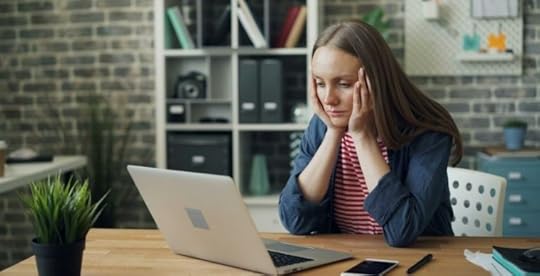 Unengaged employee at work staring at computer