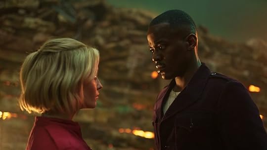 Doctor Who Boom episode Ruby Sunday and Fifteenth Doctor stand face to face in a battlefield