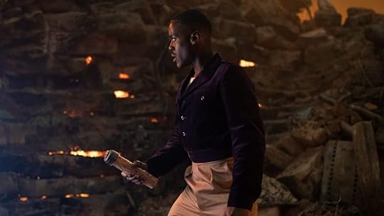 Ncuti Gatwa as Fifteenth Doctor stands on a landmine with a tube in his hand