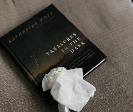 wadded up tissues on top of the Treasures in the Darkness book