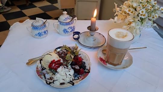 Latte macchiato and chcolate cake with ice cream and hot fruit