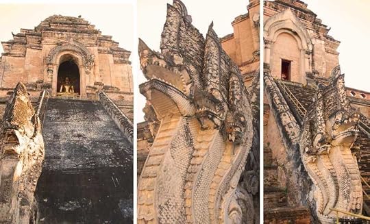 intricate carved stone Nagas (mythical serpents) flanking the steep worn stone staircases 