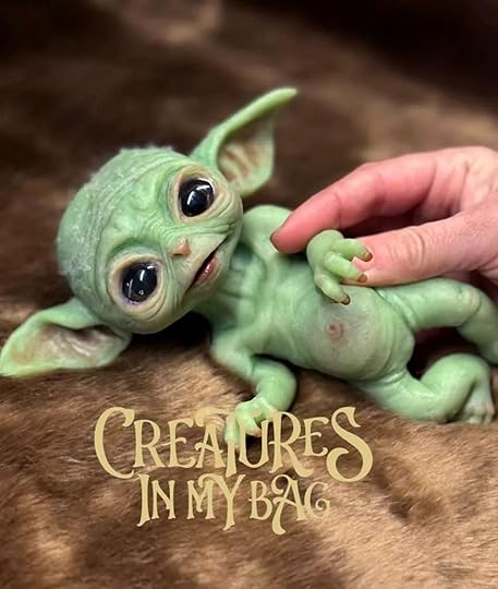 Tiny Baby Elf Yoda Version Silicone Art Doll lying down. From Creatures In My Bag.