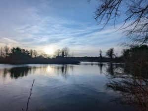 Picture of a very still lake and the sky with reflections