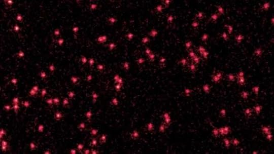 The image shows Lithium atoms cooled to near absolute zero appearing as red dots on the image. By combining several of these images, the authors were able to observe atoms behaving like waves. (Image credit: Verstraten et al.)