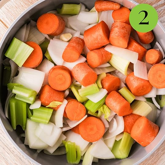 Carrots, onions, and celery in a pan ready to be cooked down for homemade vegetable broth.