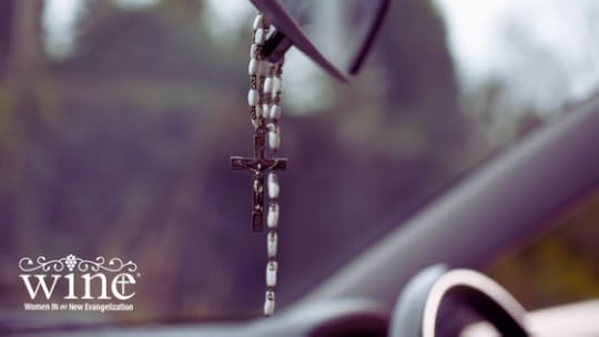 Rosary hanging from the rearview mirror