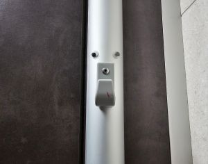 Picture of a peg to hang things on with eyes stuck above it to make it look like a grumpy face.