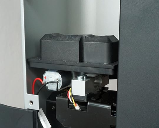 Load cell underneath the resin cartridge