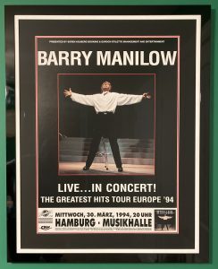 Barry Manilow tour poster for The Greatest Hits Tour '94 with his head back and arms outstretched as he stands on stage. The concert would have been held on 30 March 1994.