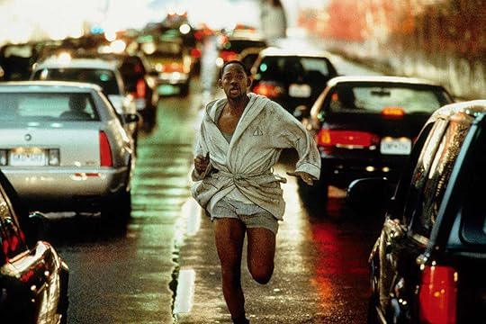 Will Smith running down the highway in his bathrobe in