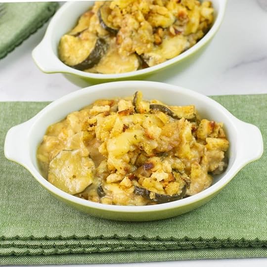 Mini casserole dish with a serving of zucchini casserole made in the crock pot.