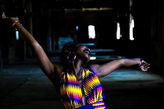 woman in a colorful dress, head back, arms out, expressing gratitude, mindfulness, and positivity