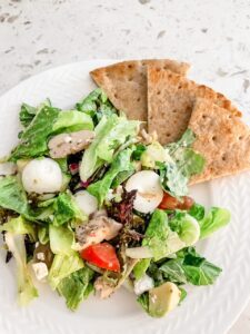 The finished Greek Inspired Chicken Cobb Salad with pita slices