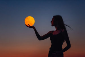 Woman Holding Sun In Her Hands