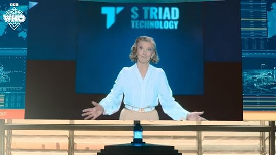 Susan Triad (Susan Twist) on a screen giving a speech in Doctor Who.