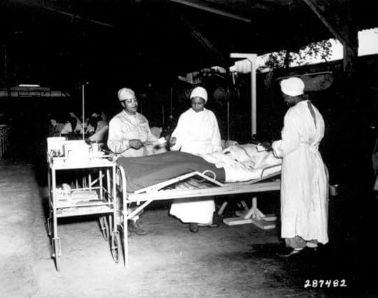 African-American US Army nurses Lt Prudence Burns, Lt Elcena Townscent, and a 3rd nurse treating Sgt Lawrence McKreever 268th Station Hospital, Milne Bay, New Guinea, 22 Jun 1944 (US National Archives: 111-SC-28748)