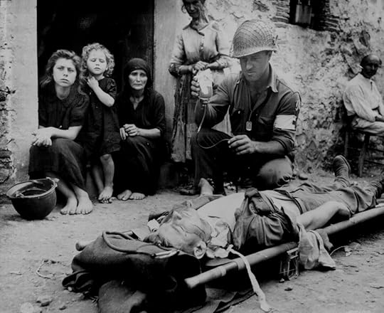 US Army medic administering plasma to wounded Private Roy Humphrey, Sant’Agata, Sicily, Italy, 9 Aug 1943 (US National Archives: 111-SC-178198)