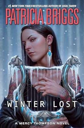 Image of a Native American woman wearing a dark tank top and holding a lyre covered in frost. The lyre has a wolf or dog's head at either end at the top and the bottom bit has a woman's face in the middle to decorate. The background is a snowy night sky.