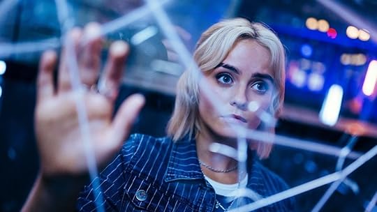 ruby sunday looks through a broken glass at images of her mother