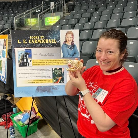 L. E. Carmichael holds an arctic fox skull at Science Rendezvous Kingston