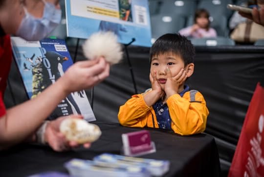 L. E. Carmichael talks to a child at Science Rendezvous Kingston