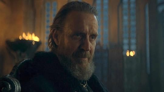 Rhys Ifans sitting in a dark room as Otto Hightower on House of the Dragon