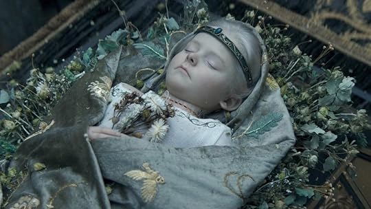 The dead Prince Jaehaerys with his sewed on head lies atop a carriage on House of the Dragon
