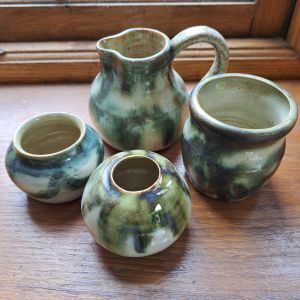 photo of four hand-thrown pots