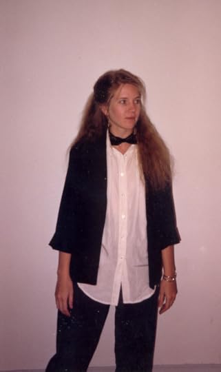 Two photos: on the left, Kelley with long blonde hair , white shirt and black bow tie looking a long, cool glass of water. On the right, Nicola and aother woman standing on crash mats—Nicola is demonstrating a strangle hold and how to break out from it