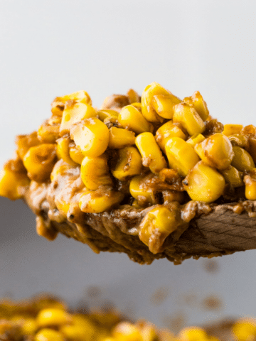 Skillet Corn on a wooden spoon.