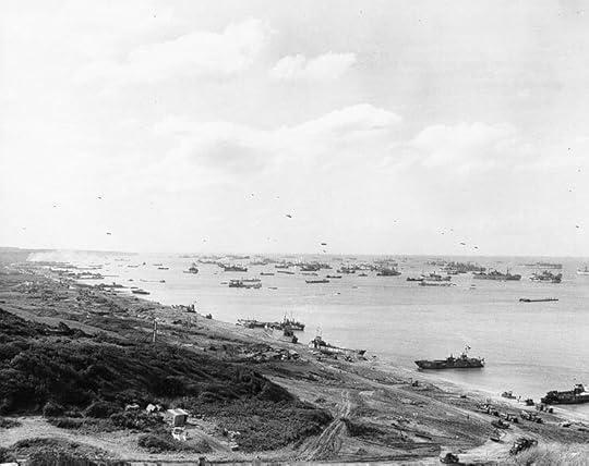 View looking west on Omaha Beach, Normandy, during resupply operations, 1 July 1944 (US National Archives: SC 206826)
