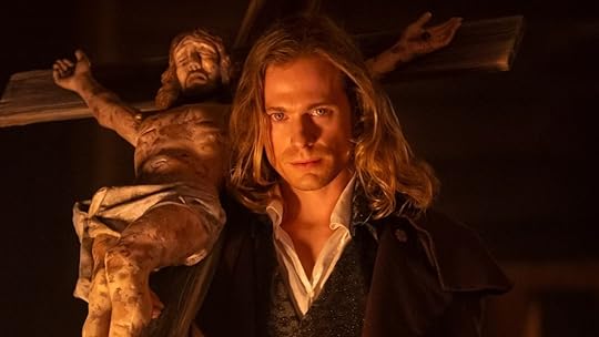 The Vampire Lestat (Sam Reid) holding a crucifix in Interview with the Vampire season two.