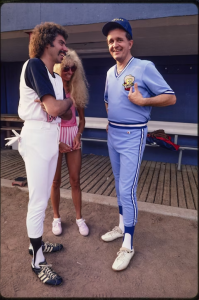 Joe Bonsall of the Oak Ridge Boys; his wife, Mary; and Bill Anderson at a softball game to benefit muscular dystrophy, held at Nashville’s Herschel Greer Stadium, 1983. Anderson played for Conway Twitty’s team, the Twitty Birds. Photo by Raeanne Rubenstein.